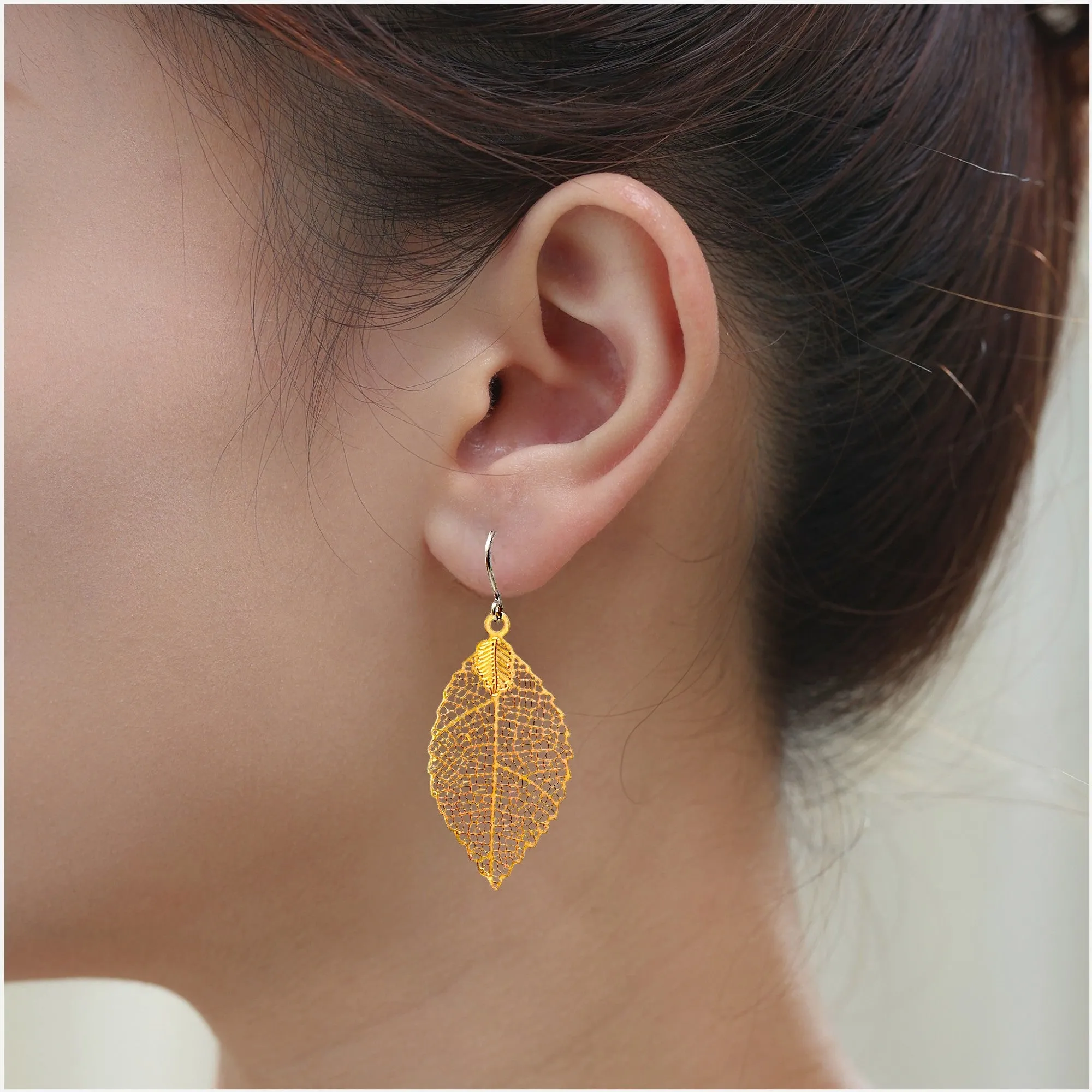 Gold disc leaf earring