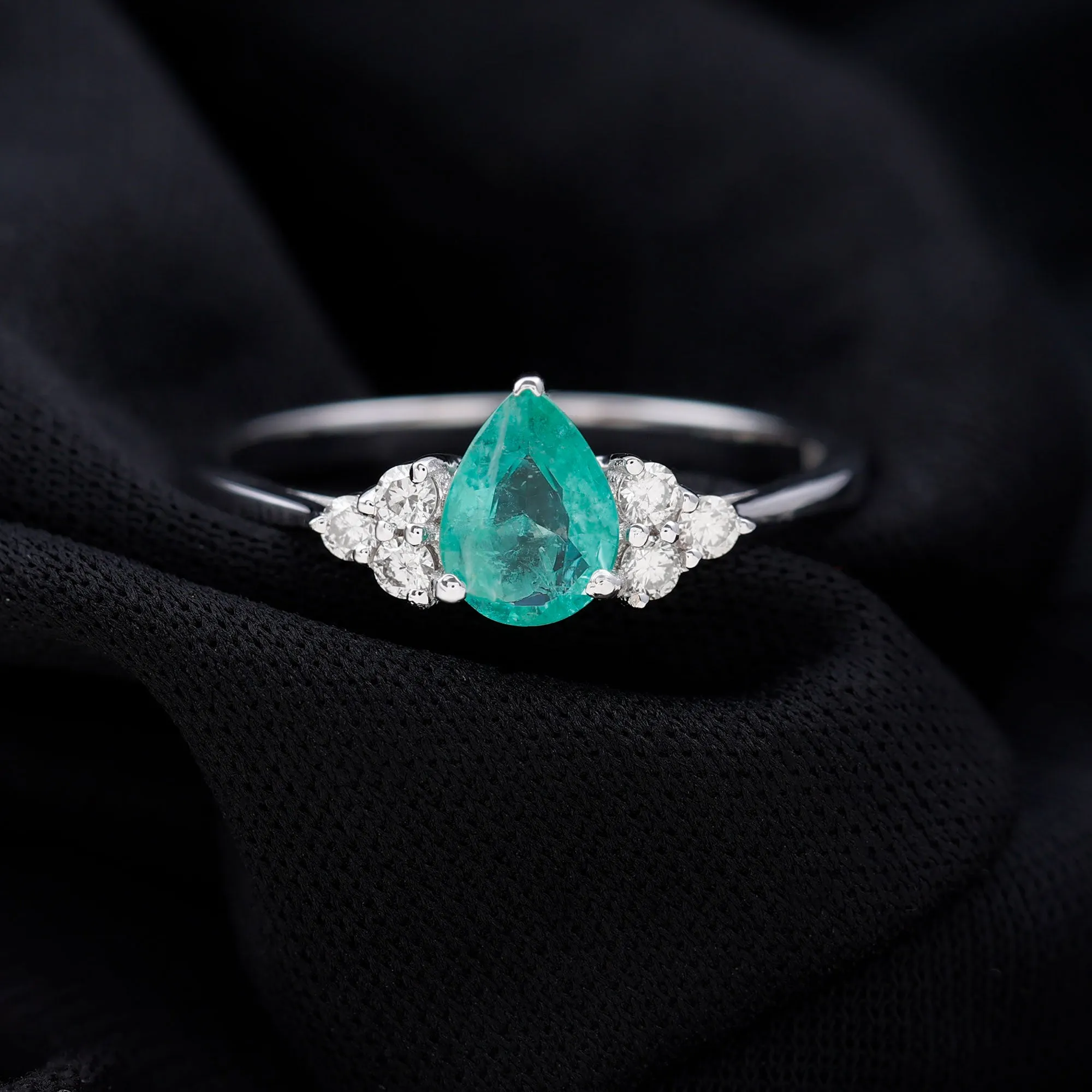 Pear Shaped Emerald Solitaire Ring with Diamond Trio